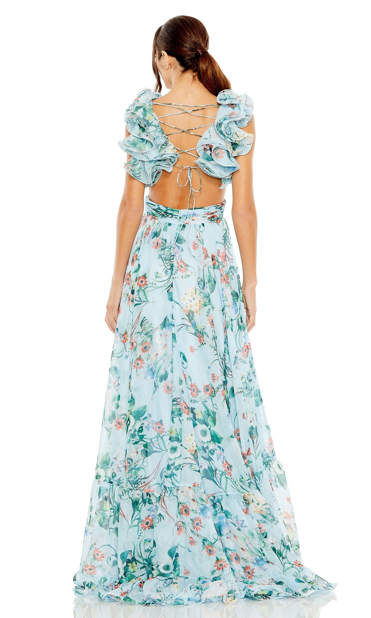 A woman stands facing away in the Long Formal Dress 68521 by Mac Duggal, a light blue a-line floral gown with ruffled sleeves, open lace-up back, and an elegant empire waist.